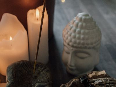 Incense stick smoke in a peaceful yoga room.